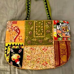 Exquisite bejeweled bag with zipper and satin lining